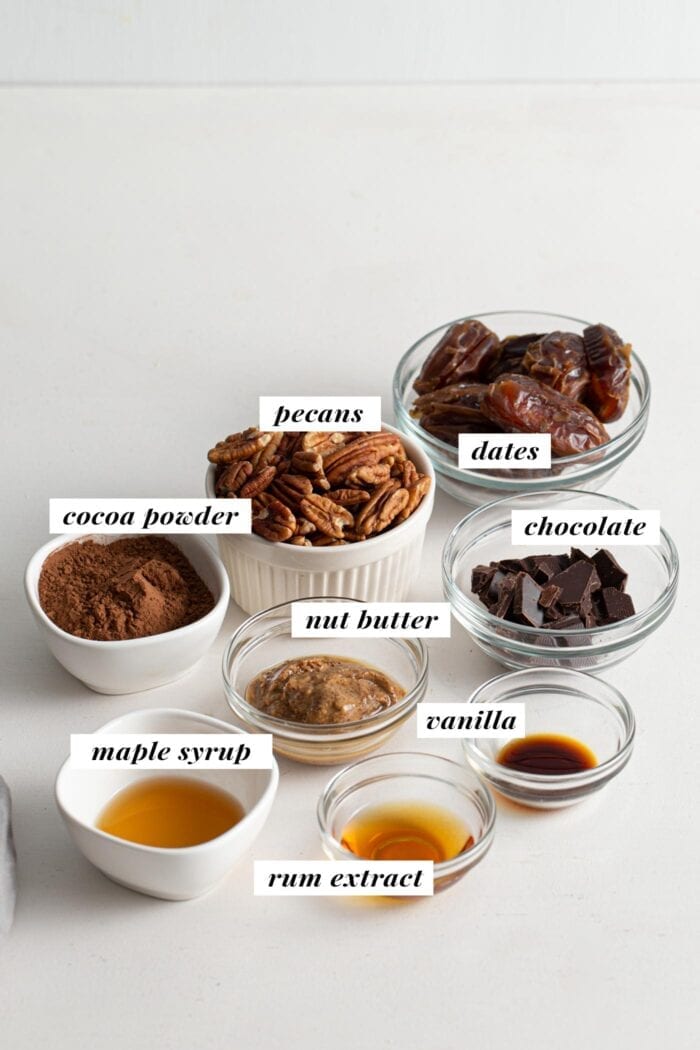 Visual of ingredient list for healthy vegan rum balls recipe.