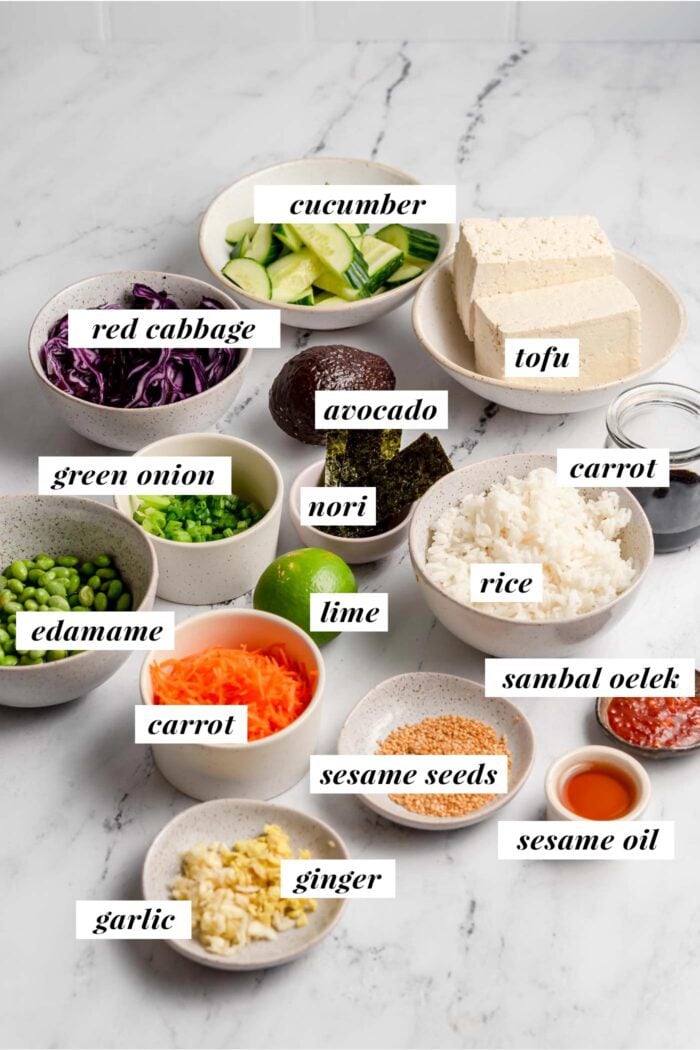 All of the ingredients gathered in bowls for making a vegan tofu poke bowl recipe.