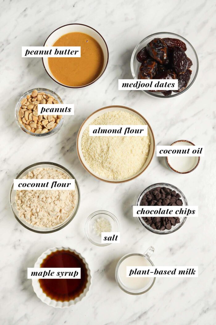 Visual of ingredients for making homemade snickers bars. Each ingredient is labelled with a text overlay.