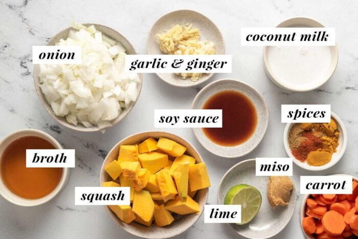 Visual list of ingredients for making a kabocha squash and carrot curried soup.