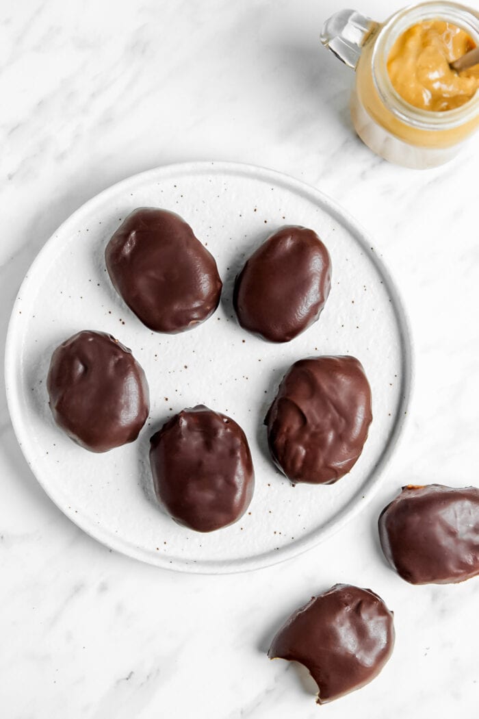 A plate of homemade Reese's chocolate-covered peanut butter eggs.